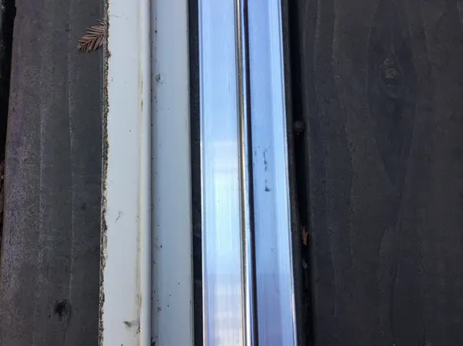 A close up of the window sill and door