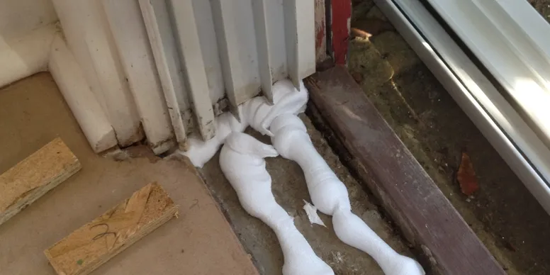 A couple of white pipes laying on the ground.